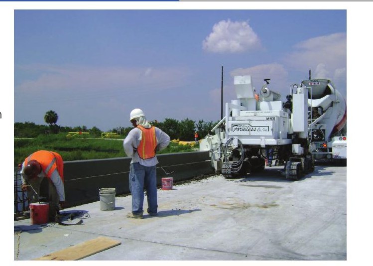 Miller Formless M-8100 slipforming a highway parapet wall