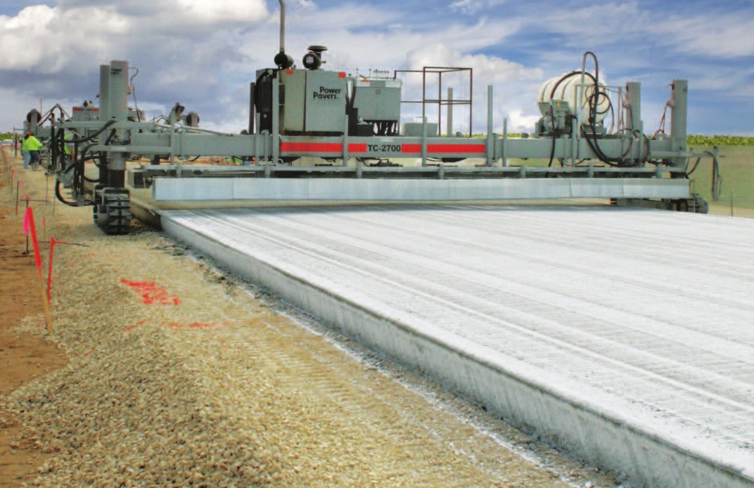 Power Pavers TC-2700 texture/curing machine finishing new concrete pavement